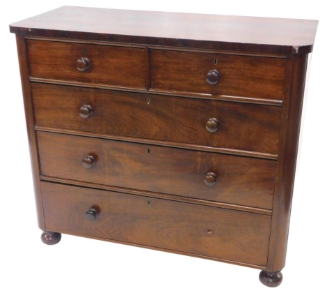 A Victorian mahogany chest of drawers, the top with rounded corners above two short and three long drawers, each with turned handles, on bun feet, 109cm wide.