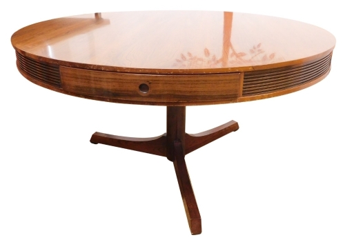 A Robert Heritage for Archie Shine Indian rosewood drum top library table, with four drawers each with circular recess handles, on a cylindrical column and four splayed legs, 140cm high, 73cm wide.