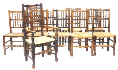 A harlequin set of ten 19thC Lancashire spindle back chairs, each with a rush seat, one with arms.