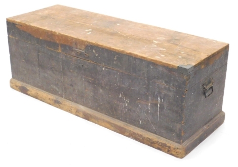 A 19thC pine tool chest, of rectangular form with metal handle, on block base, 50cm high, 123cm wide, 44cm deep.