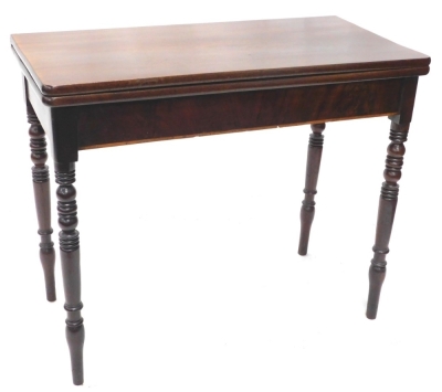 A 19thC mahogany fold over tea table, on turned legs, 77cm high, 90cm wide, 46cm deep.