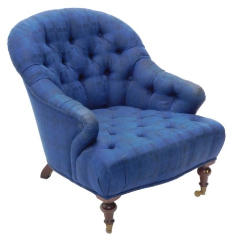 A Victorian style tub chair, with blue tartan button upholstered back and seat, on turned legs with castors.