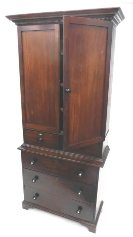 An associated 19thC estate made mahogany cabinet, the top with a moulded and dentil cornice, above two panelled doors enclosing adjustable shelves, and two drawers with turned ebonised handles, the base with a further three drawers, on bracket feet, 217cm