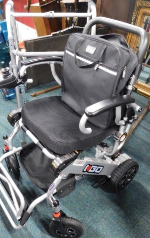 An electrical four wheeled mobility power wheelchair, and a zimmer frame.