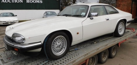 A 1993 Jaguar XJ-S Sports Coupe, registration K777 MEG, currently on SORN, last MOT expired 3rd July 2019, unlocked without keys, known mileage 125,803, no V5. To be sold upon instructions from the Executors of Susan Gaisford (Dec'd).