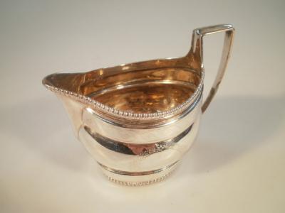A George III silver boat-shape cream jug
