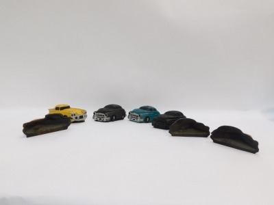 Seven cast iron car door stops, of various painted designs, each approx 20cm to 25cm wide. - 2