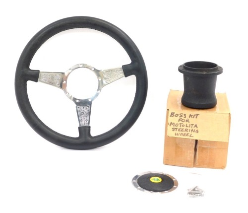 A Moto Lita steering wheel, and a Boss kit unit for the wheel.