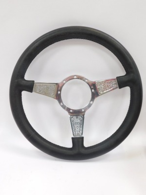 A Moto Lita steering wheel, and a Boss kit unit for the wheel. - 2