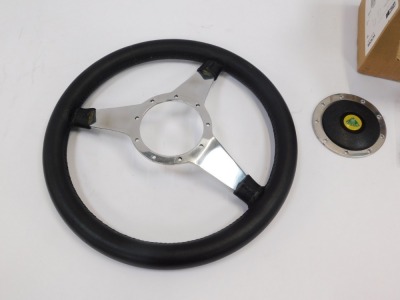A Moto Lita steering wheel, and a Boss kit unit for the wheel. - 4