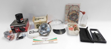 A group of car related wares, including a remote control car alarm, a Stadium visor, a head lamp projector, collapsible car ramp, various auto bulbs, two cased amp meters, etc. (a quantity)