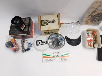 A group of car related wares, including a remote control car alarm, a Stadium visor, a head lamp projector, collapsible car ramp, various auto bulbs, two cased amp meters, etc. (a quantity) - 2