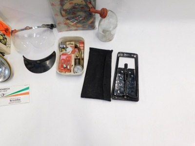 A group of car related wares, including a remote control car alarm, a Stadium visor, a head lamp projector, collapsible car ramp, various auto bulbs, two cased amp meters, etc. (a quantity) - 3