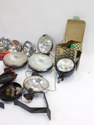 A group of motoring parts, comprising bulbs, indicator lights, head lamps, cased set, Citroen lamps, Butlers cased headlamps, steering wheel, etc. (2 boxes) - 4