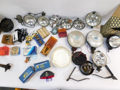 A group of motoring parts, comprising bulbs, indicator lights, head lamps, cased set, Citroen lamps, Butlers cased headlamps, steering wheel, etc. (2 boxes) - 5