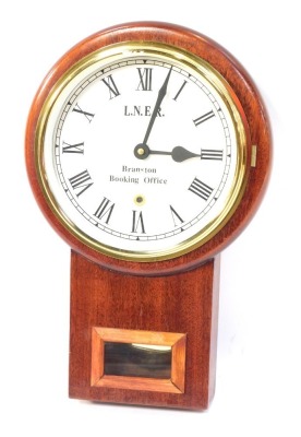 An LNER Branston Booking Office wall clock, in a oak case, 40cm high, 26cm wide.