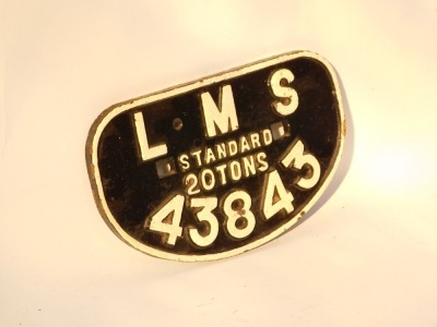 An LMS Standard 20 tons wagon plate, No 43843, on black with cream bordering, 29cm wide. - 2