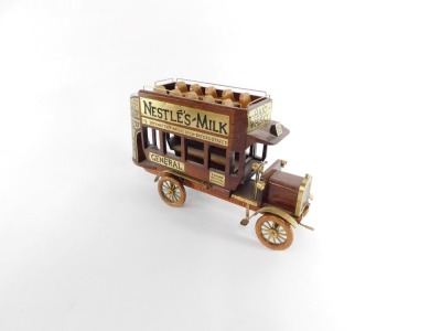 An Xerklif hand made wood and brass detailed 1907 London General Omnibus, hand made in wood with brass advertising plates. - 2