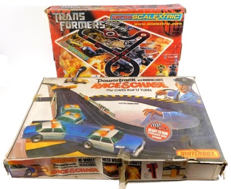 Micro Scalextric and Matchbox Power Track slot racing sets, comprising Transformers Bumblebee and Barricade set and Matchbox Power Track Race & Chase set, boxed. (2)