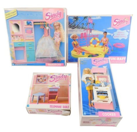 A Sindy wardrobe, cooker, fun raft, and a telephone table, all boxed. (4)