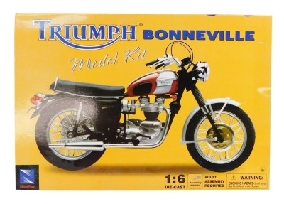 A Triumph Bonneville model kit, 1:6 scale, diecast, boxed.