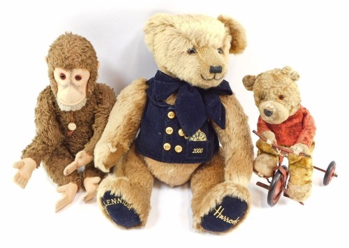 Soft toys, comprising a Merrythought Harrods Millennium bear, a Hermann monkey and a Chiltern Teddy Bear on tricycle. (3)