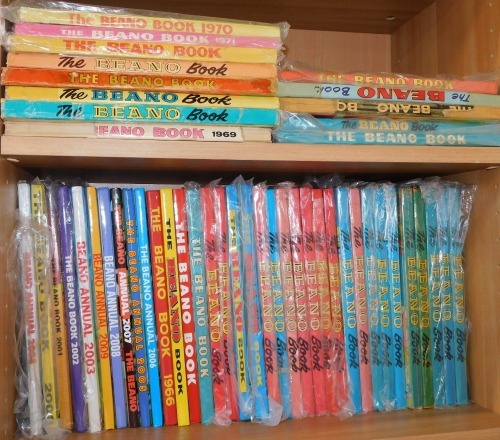 Beano annuals, including The Beano Book 1969, The Beano Annual 2003, The Beano Book 2002, 1966, 2000. (2 shelves)