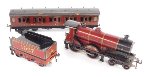 A Bassett Lowke tin plate O gauge CN/4-4-0 locomotive and tender, Duke of York, LMS maroon livery. 1927, together with a Bassett Lowke O gauge LMS 1st class coach. (3)