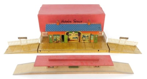 A Hornby series O gauge tin plate station and platform.
