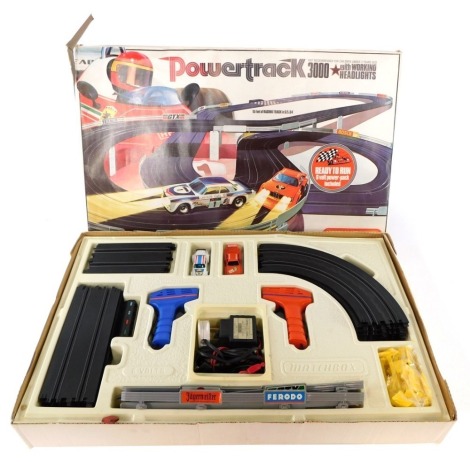 A Matchbox Powertrack slot car racing set, PT3000 Super Sport with working headlights, including BMW 3.5 and Jaguar XJ/12.