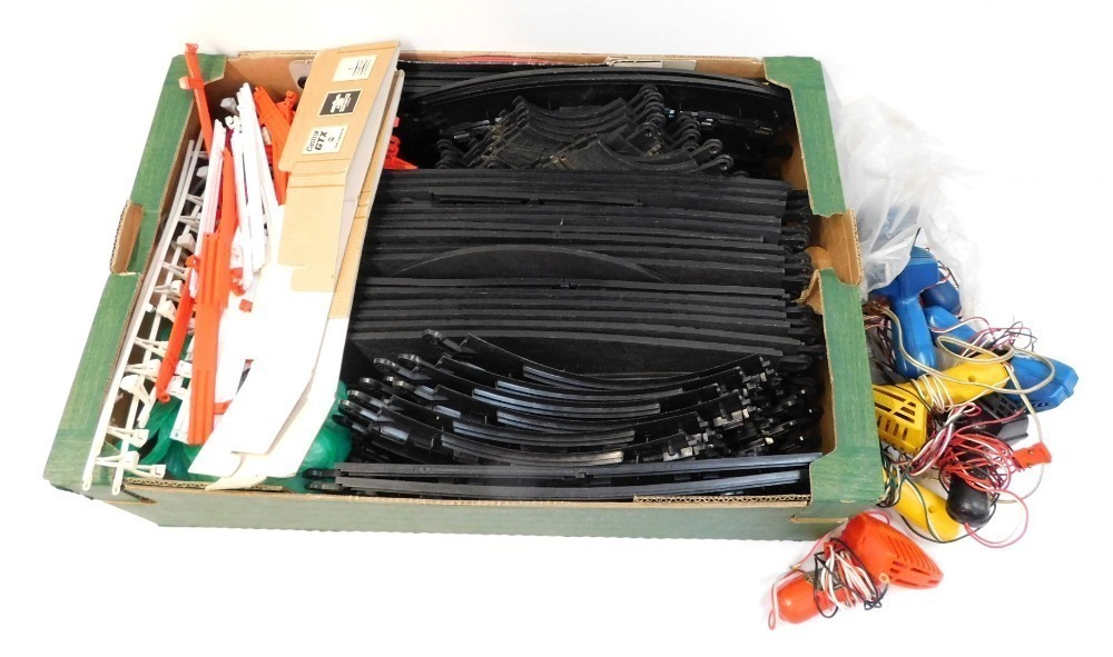 Scalextric slot car track and accessories, including curves and straights, controllers, barriers