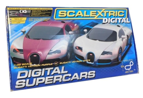A Scalextric Digital Supercars slot racing set, containing purple and white Bugatti Veyrons 16:4, boxed.
