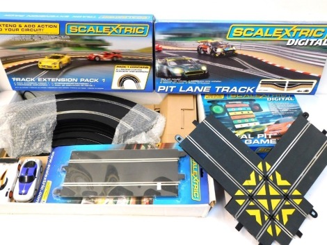 Scalextric Digital accessories, including Pit Lane Track, Track Extension Pack One, Digital Pit Lane game, etc. (a quantity)