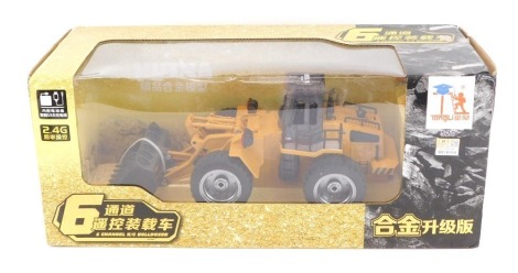 A Hulna Super TongLi 6 channel remote controlled die cast bulldozer, boxed.