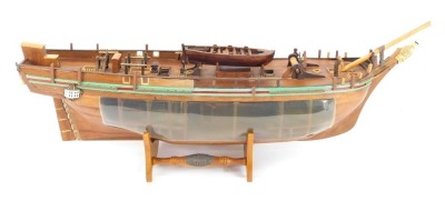 A scratch built model of the hull of HMS Bounty, with visible cross section, 70cm wide.