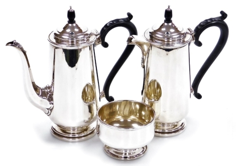 A George V silver coffee pot, matching hot water jug and sugar basin, Robert Pringle and Sons, London 1918, 41½oz gross.