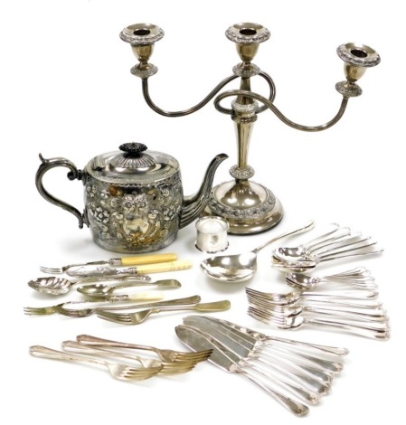 A group of plated wares, to include a late 19th/early 20thC electroplated teapot, with ebonised knop, scroll handle, the body profusely decorated with flowers, scrolls, etc., a candelabra 28cm high, napkin ring, loose flatware, etc. (a quantity)