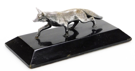 An early 20thC silver plated figure of a fox, in running pose, mounted on an ebonised plinth, the plinth 21.5cm wide, the fox 14.5cm wide.