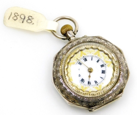 A late 19thC Swiss white metal pocket watch, of octagonal form, open faced, keyless wind, the case engraved with flowers, leaves, etc., in the Aesthetic style picked out in blue enamel, the enamel dial with Roman numerals and outer gilt border, stamped 92