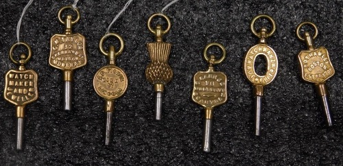 A group of decorative pocket watch keys, mainly relating to jewellers from Grantham and Lincolnshire, to include Bothamley of Boston, J. Osbourne of Grantham, John William Gibbins of Lincoln, GM Taylor of Melton Mowbray, and JD Fisher of Lincoln. (6)