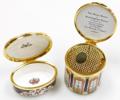 An enamelled circular music box for the music room at Buckingham Palace, playing Voi Che Sapete from Mozart's the Marriage Of Figaro, limited edition number 236/250, 7.5cm high, four porcelain lidded boxes, and a Reid's Palace pin tray, 11.5cm wide. - 7