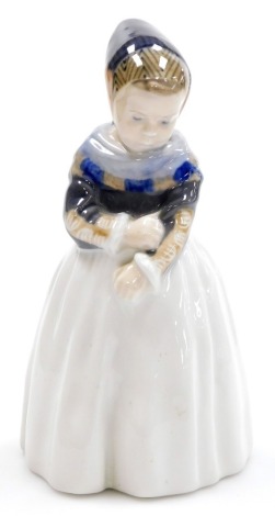 A Royal Copenhagen porcelain model of a Dutch girl, number 1251, printed marks, 19cm high.