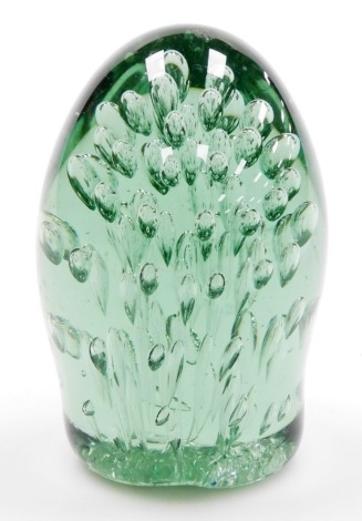 A Victorian green glass dump weight, with air bubble inclusions, 11cm high.