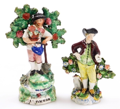 An 18thC Walton type pottery figure, of a gardener with bocage, 15cm high, and an early 19thC pearlware figure of a man holding a letter, with dog and bocage, 11cm high.