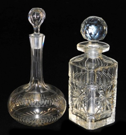 A square cut glass decanter, with star and groove cut decoration and faceted stopper, 23.5cm high, and a globe and shaft glass decanter, with groove cut and etch banded decoration, and tapered hexagonal stopper, 24cm high.