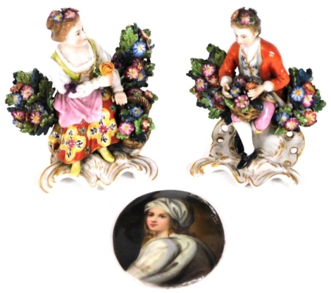 A pair of Samson porcelain figures of flowers sellers, with faux Chelsea gold anchor marks, 8.5cm high, and a porcelain portrait miniature of a lady, 6.5cm x 5cm. (3)