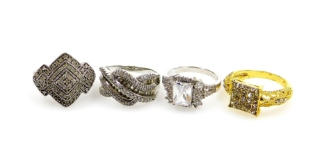 Four silver dress rings, comprising three stone set white silver coloured dress rings, and a gold finish silver agate ring, boxed. (4)