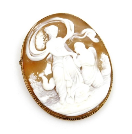 A 9ct gold framed oval cameo brooch, with a rope twist outer border and cameo depicting male and female figures, 5cm x 4cm, 12.1g all in.