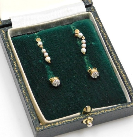 Two pairs of earrings, comprising a pair of small 9ct gold diamond cluster earrings each set with seven stones, and a pair of seed pearl drop earrings, 2.3g all in.