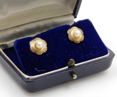 A pair of floral cluster earrings, each with a central cultured pearl with outer fan design flower, on stick pin back, with butterfly backs only marked 9ct, 41.8g all in, boxed.